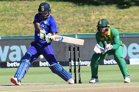 Indian opener Shikhar Dhawan plays a shot as South Africa's Quinton de Kock (right) looks on during the first One Day International at Boland Park in Paarl on Wednesday.