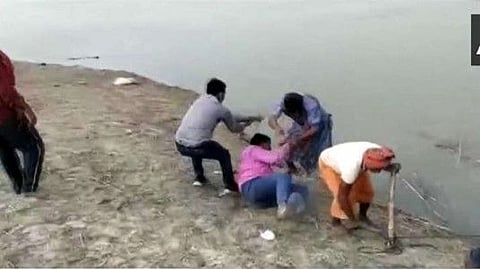 Boatman tries to drag healthcare worker into the water.