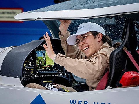 Zara Rutherford smiles after she landed with her Shark ultralight plane at the Egelsbach airport in Frankfurt, Germany.