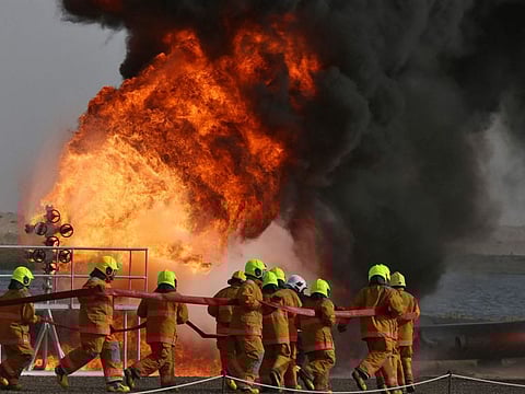 Kuwaiti fire service, national guard, civil defence and members of the army take part in the "Shamel 7 fire drill in the Arifjan area, 65km south of Kuwait City, on January 20, 2022. Friday's fire in the Shuaiba Industrial Area in eastern Kuwait did not result in any injuries