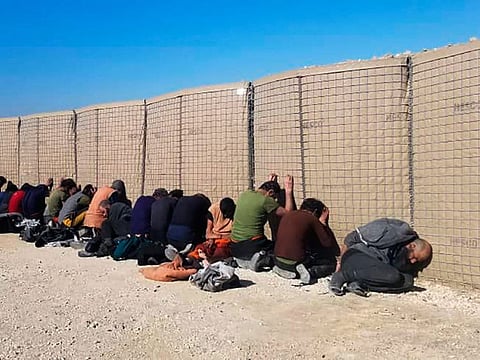 This photo provided by the Kurdish-led Syrian Democratic Forces, shows some Daesh terrorists, who were arrested by the Kurdish-led Syrian Democratic Forces after they attacked Gweiran Prison, in Hassakeh, northeast Syria, on January 21, 2022.