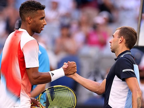 Britain's Daniel Evans (right) greets Canada's Felix Auger-Aliassime after their men's singles match on day six of the Australian Open tennis tournament in Melbourne.