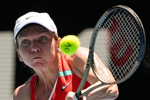 Simona Halep of Romania plays a backhand return to Danka Kovinic of Montenegro during their third round match at the Australian Open tennis championships in Melbourne, Australia.