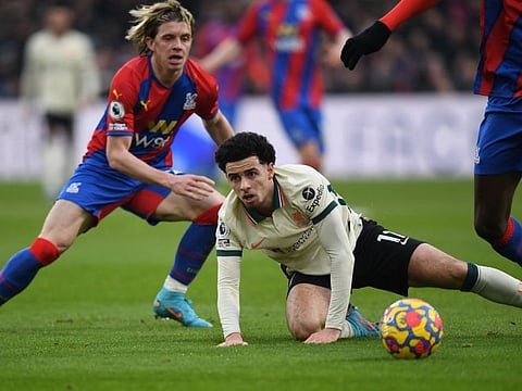 Liverpool's English midfielder Curtis Jones (centre) is tackled by Crystal Palace's English midfielder Conor Gallagher during the English Premier League match at Selhurst Park in south London.