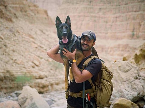 Hussain Hussam Darwish with his dog on one of his adventure trips.