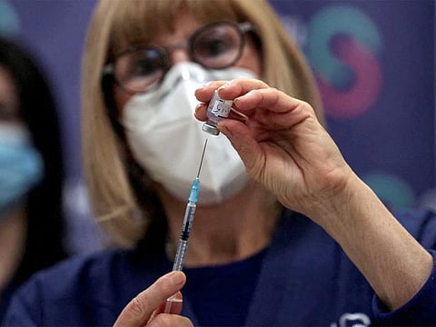 A nurse prepares a fourth dose of COVID-19 vaccine as part of a trial in Israel, at Sheba Medical Center in Ramat Gan, Israel.