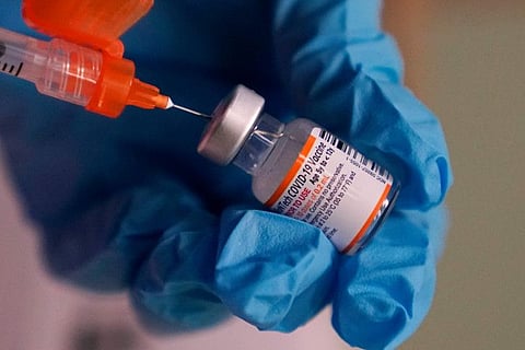 Pharmacist Sima Manifar prepares a children's dose of the Pfizer COVID-19 vaccine during a vaccination clinic at City of Lawrence's "The Center," which serves seniors, families and the community, December 29, 2021, in Lawrence, Massachusetts. Pfizer has begun a study comparing its original COVID-19 vaccine with doses specially tweaked to match the omicron variant. Pfizer and its partner BioNTech announced the study on January 25, 2022.