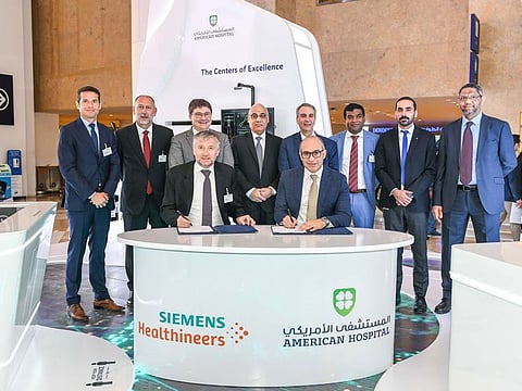 Senior executives from American Hospital and Siemens Healthineers during the signing ceremony