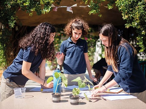 American School of Dubai students conduct an experiment in this February 2020 photo