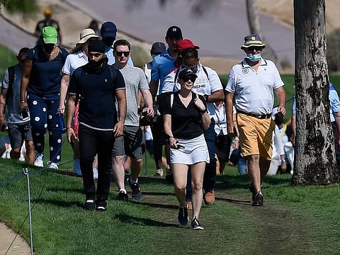 Fans follow the Dubai Desert Classic action