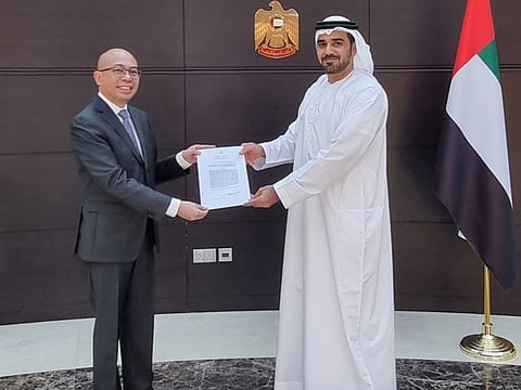Philippine Consul-General Renato N. Duenas, Jr (left) presents his consular commission to Deputy Director Rashid Abdulla Al Qaseer of the UAE Ministry of Foreign Affairs and International Cooperation today.