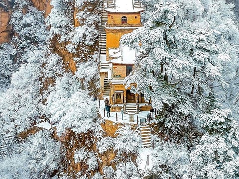 This aerial photo taken on January 25, 2022 shows a view of the Kongtong Mountain after a snowfall in Pingliang, in China's northwestern Gansu province.