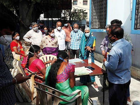 People wait for Covid test at a government hospital in Hyderabad