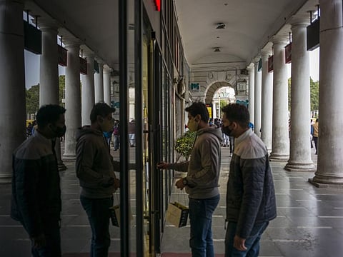 Shoppers outside a clothing store at Connaught Place in New Delhi, India, on Wednesday, Jan. 26, 2022.