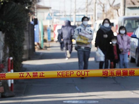 People return from the evacuation site, after a man who stood in a private house, was arrested in Fujimino, Saitama prefecture on January 28, 2022.