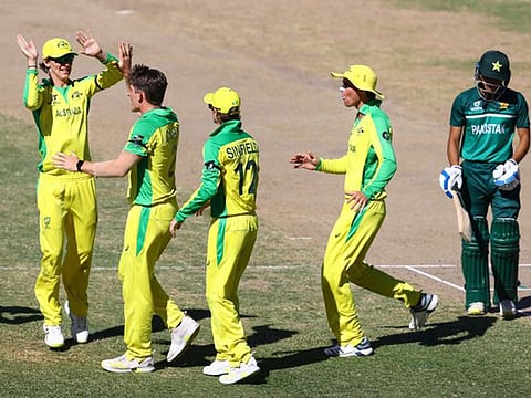 The Australian Under-19 team members jubilate at the fall of a Pakistan wicket on Friday.