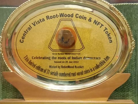 The root-wood coins, carved out of the root-wood of a tree that was excavated during the construction of the Central Vista Avenue in the Indian capital’s administrative nerve centre.