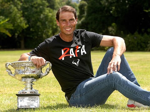 Rafael Nadal of Spain poses with the Australian Open men’s singles trophy at the Government House in Melbourne, Australia, on January 31, 2022.