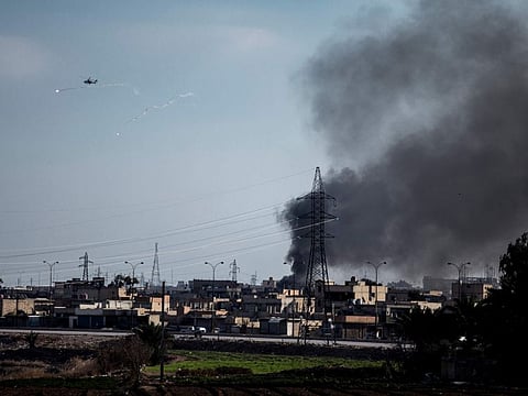 US attack helicopter shoots flares in Hasakeh, northeast Syria, on January 26, 2022. With a spectacular jail break in Syria and a deadly attack on an army barracks in Iraq, Daesh was back in the headlines the past week, a reminder of a war that formally ended three years ago but continues to be waged away from view.