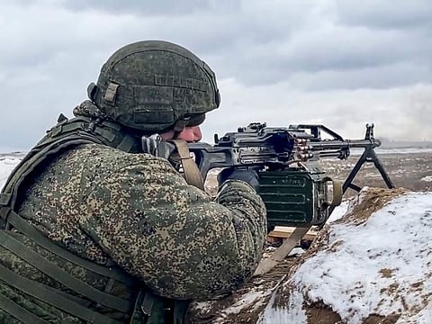 In this photo taken from video and released by the Russian Defence Ministry Press Service on February 2, 2022, a soldier fires during a Russian and Belarusian joint military drills at Brestsky firing range, Belarus.