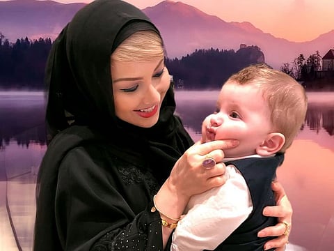Erika Al Harmoodi with her newborn son Mansoor.
