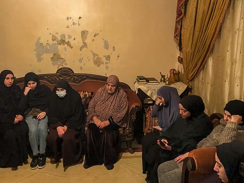 Umm Alaa, third left, the mother of Omar Seif who was killed over the weekend in Iraq in her apartment surrounded by friends and relatives who came to pay condolences for her, in the northern Lebanese village of Wadi Nahleh, Lebanon, on February 2, 2022.