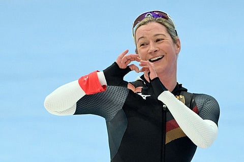 Olympic record holder Germany's Claudia Pechstein gestures after competing in the women's speed skating 3000m event during the Beijing 2022 Winter Olympic Games at the National Speed Skating Oval in Beijing.