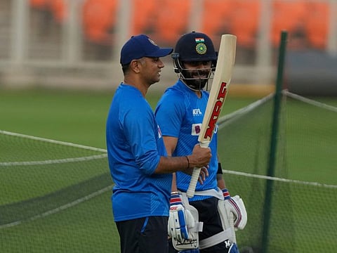 India’s coach Rahul Dravid looks at Virat Kohli’s bat during a practice session ahead of their first One-Day International in Ahmedabad on Friday.