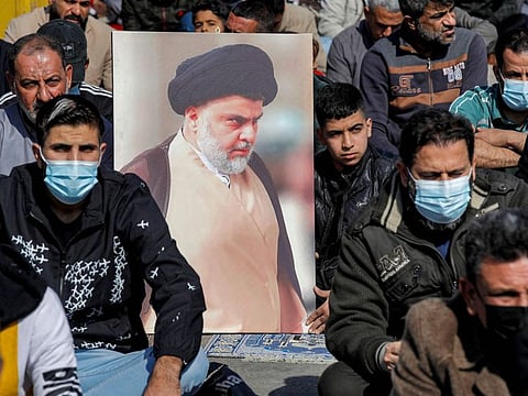 Supporters of Iraqi Shiite Muslim cleric Moqtada Al Sadr perform the weekly Friday prayers in the Sadr City suburb of Iraq's capital Baghdad on January 28, 2022.