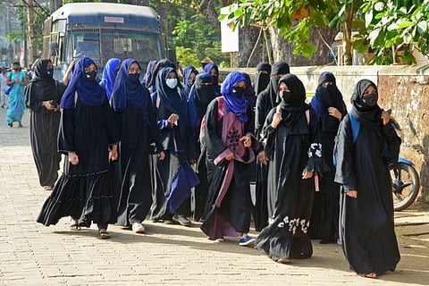 Students of government Pre-University college in Kundapur town wearing hijab arrive at their college in Udupi district in India's Karnataka state on February 7, 2022.