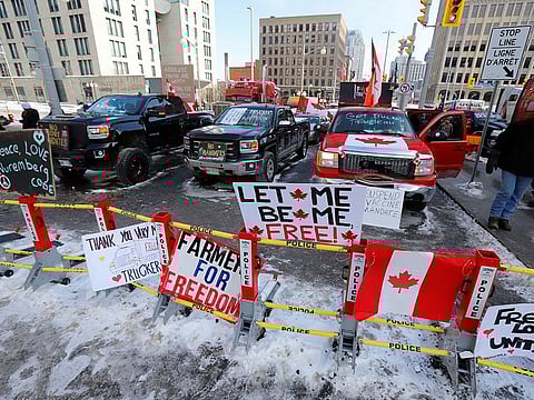 Signs sit on a police baracade as truckers and their supporters continue to protest coronavirus disease (COVID-19) vaccine mandates, in Ottawa, Ontario, Canada, February 7, 2022.