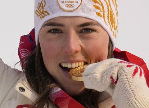 Petra Vlhova, of Slovakia celebrates during the medal ceremony after winning the gold medal in the women's slalom at the 2022 Winter Olympics in the Yanqing district of Beijing.
