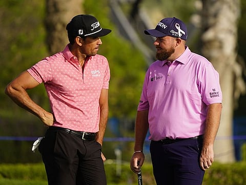 Rafa Cabreara Bello with Shane Lowry during the Dubai Desert Classic at Emirates Golf Club