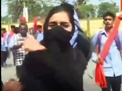 A grab from the video that has gone viral of Muskan Khan confronting men in Mandya college.