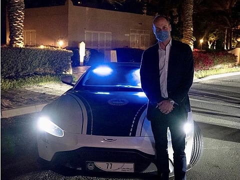 Prince William tweeted this photo with him standing next to Dubai Police's Aston Martin Vantage supercar during his visit to UAE.