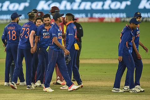 India's players celebrate their win against West Indies' after the end of play on the third and final one-day international (ODI) at the Narendra Modi Stadium in Motera.