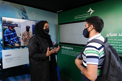 Dr Ayesha Al Basti (L) from the DHA with a visitor at the 'Mindspire' event at Expo 2020 Dubai
