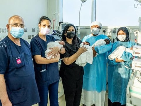 Roaya Tawakol (far right) and her husband Ahmad Hussain Rajad Qambar Jassim (second right) with their quadruplets with the Medcare hospital team.