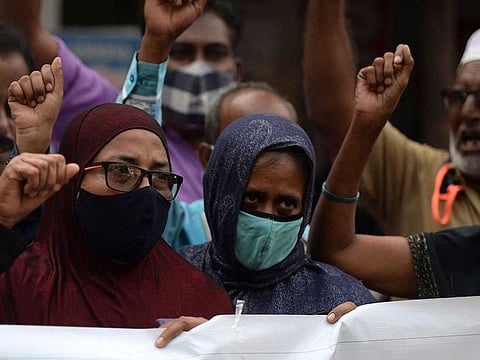 People take part in a demonstration to denounce the ban on girls wearing hijab to attend classes in Karnataka's educational institutes, in Chennai on February 14, 2022.