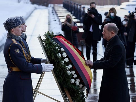 German Chancellor Olaf Scholz takes part in a wreath-laying ceremony at the Tomb of the Unknown Soldier by the Kremlin Wall in Moscow, Russia, on February 15, 2022.