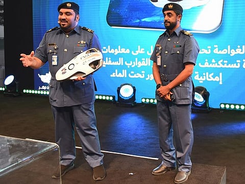 Dubai Customs senior inspection officers Nawaf Saleh and Salim Ghaith explaining how the underwater drone works during UAE Innovates 2022 at Expo 2020 Dubai