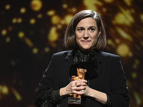 Carla Simon receives the Golden Bear for best film for her movie 'Alcarras' during the awarding ceremony at the International Film Festival Berlin 'Berlinale', in Berlin, Germany, Wednesday, Feb. 16, 2022.
