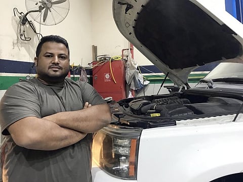 Mohammed Ahsan Ullah at his SUV repair shop in Sharjah