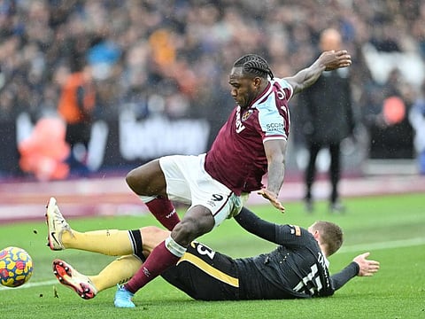 West Ham United's midfielder Michail Antonio (top) fights for the ball with Newcastle United's defender Matt Targett during the English Premier League football match at the London Stadium, in London.