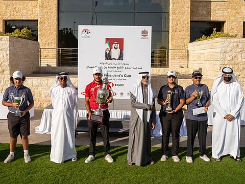 Sheikh Nayhan bin Mubarak Al Nayhan, Sheikh Fahim Al Qasimi, Chairman of the EGF, Najeeb Ahmed Busheri (HSBC) with the overall and divisional winners of the 2022 Presidents Cup held at Abu Dhabi Golf Club.