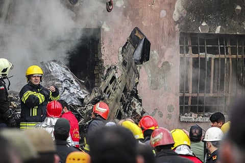 In this photo released by Tasnim News Agency, the wreckage of a fighter jet is seen after the crash at the city of Tabriz in northwestern Iran, February 21, 2022.