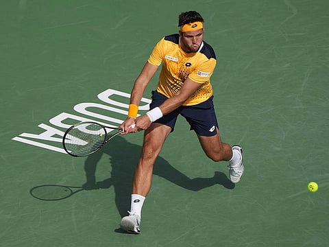 Jiri Vesely in action against Marin Cilic in Dubai