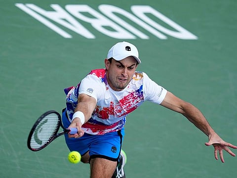 Aslan Karatsev in action against Mackenzie McDonald during the Dubai Duty Free Tennis Championships