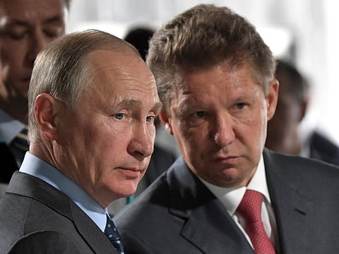 Russian President Vladimir Putin, left, and Alexei Miller, Russian natural gas giant Gazprom CEO, attend a meeting of major investment projects at the Nizhne-Bureiskaya Hydroelectric Power Plant in Novobureyskiy, Russia, in a file photo.