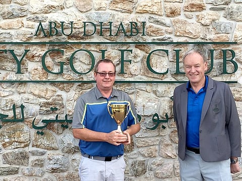 Rob Smith (left), winner of the 2022 Abu Dhabi City Golf Club Men's Open, with club captain Kenny Macaulay.
